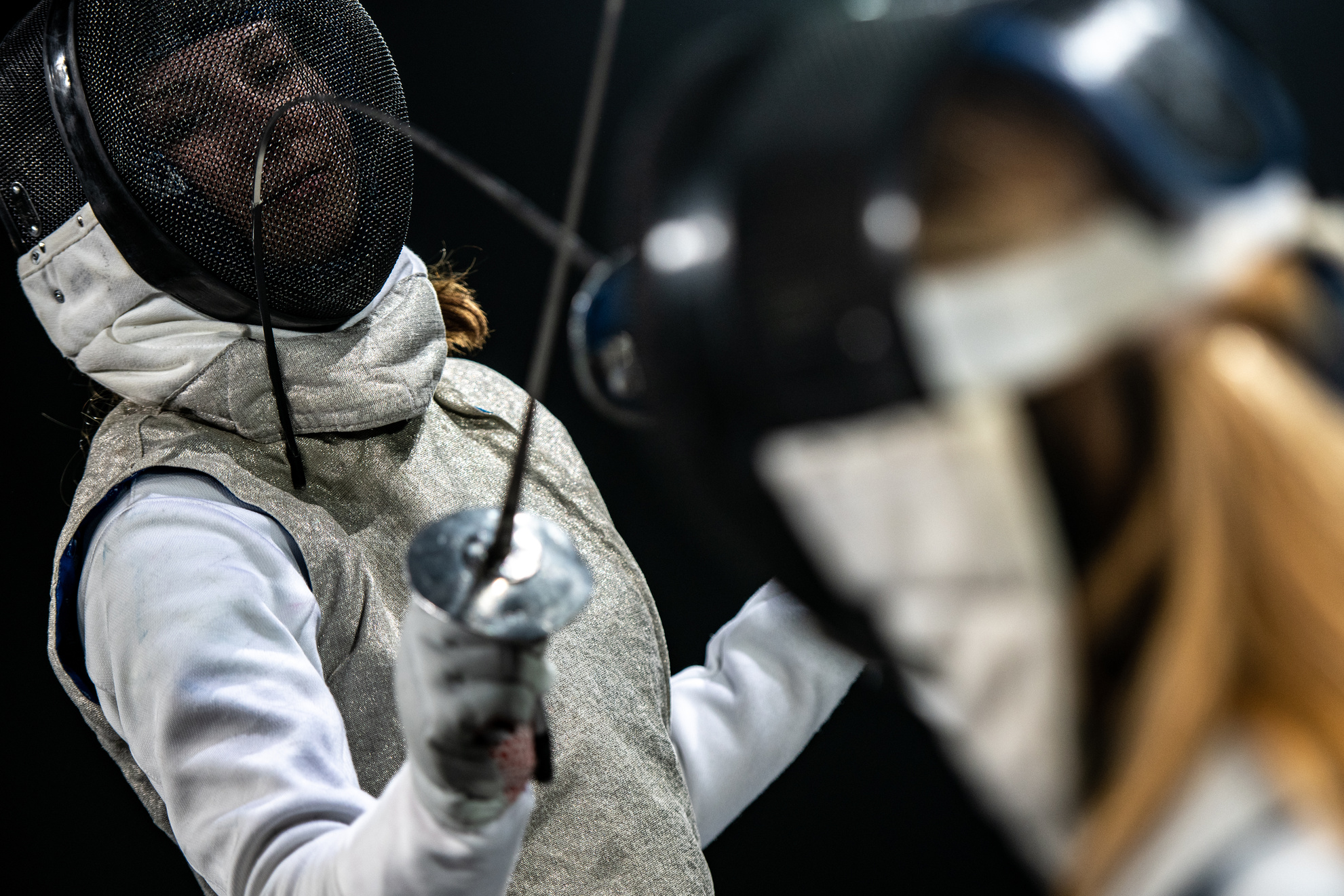 Female fencing sport duel