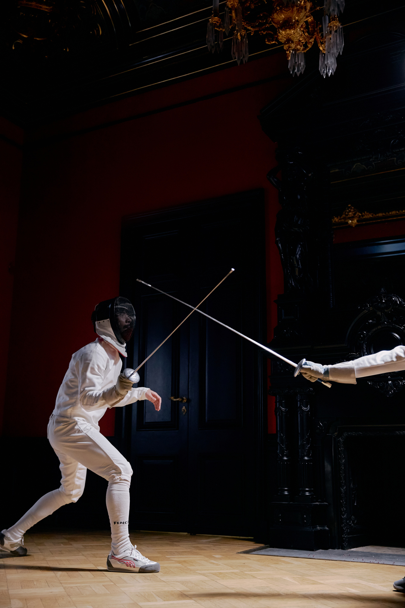 Two Men In Fencing Suit Practicing With Sword